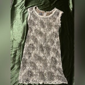 Snake print like pattern on a lace dress.